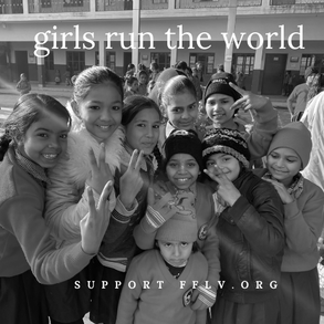 A group of smiling young school girls flashing peace signs in Vrindavan, Indis